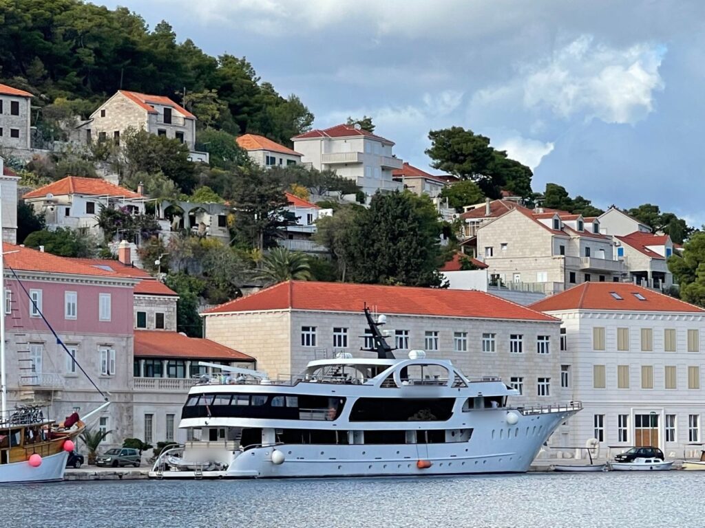 Private charter yacht tied up in a small island harbor in Croatia