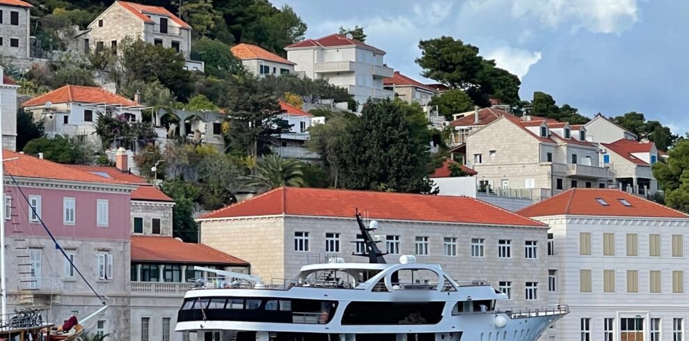 Private charter yacht tied up in a small island harbor in Croatia